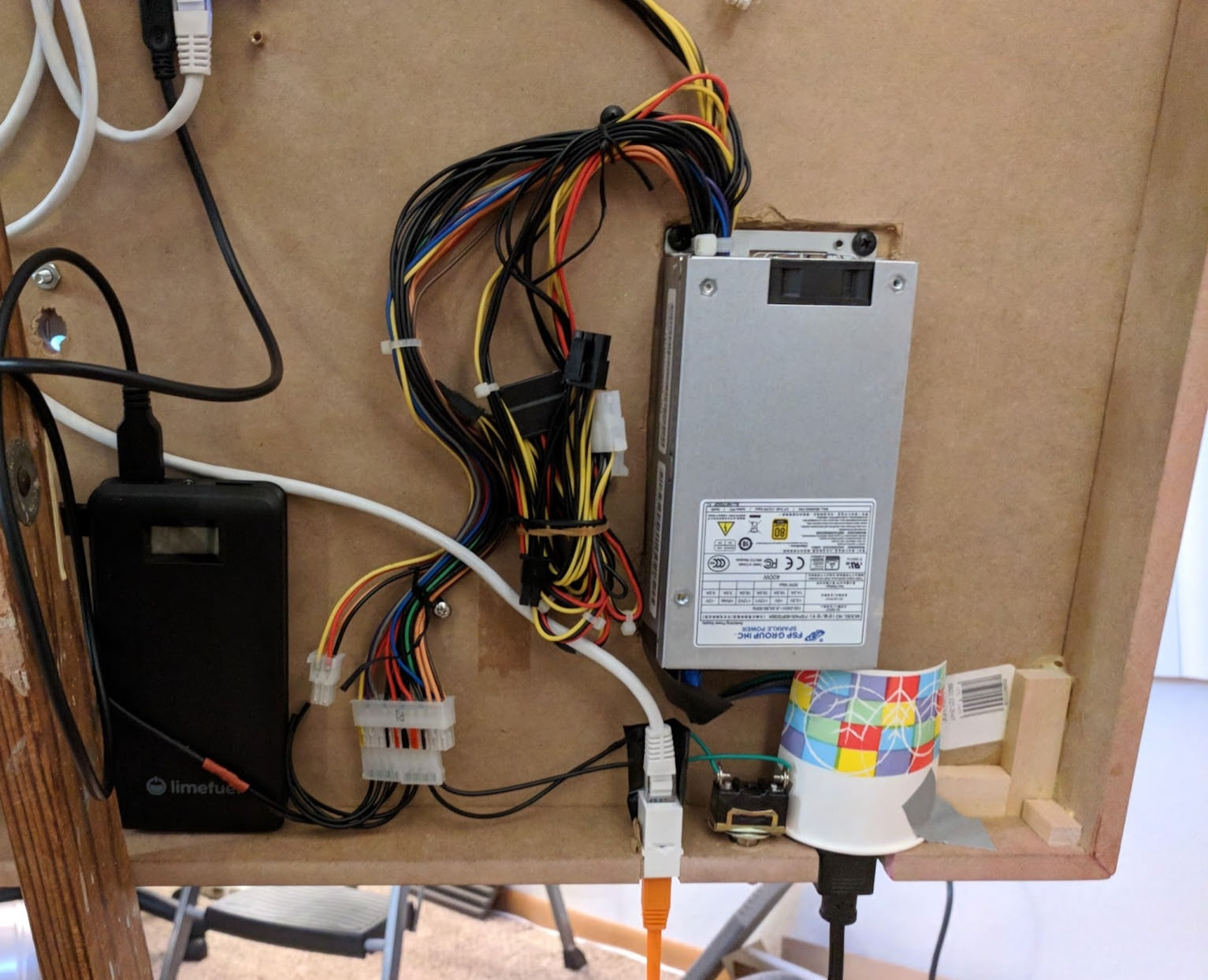 Showing off the wiring of the power supply and connectors on the bottom
